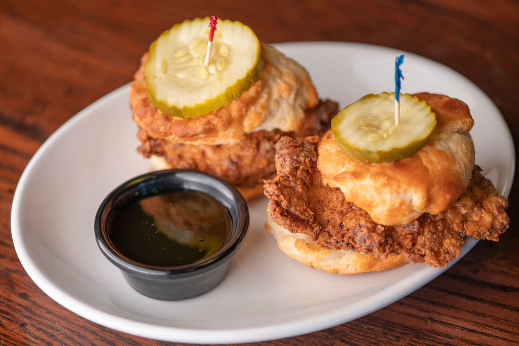 Nashville hot fried chicken breast on biscuits with pickles & side of honey