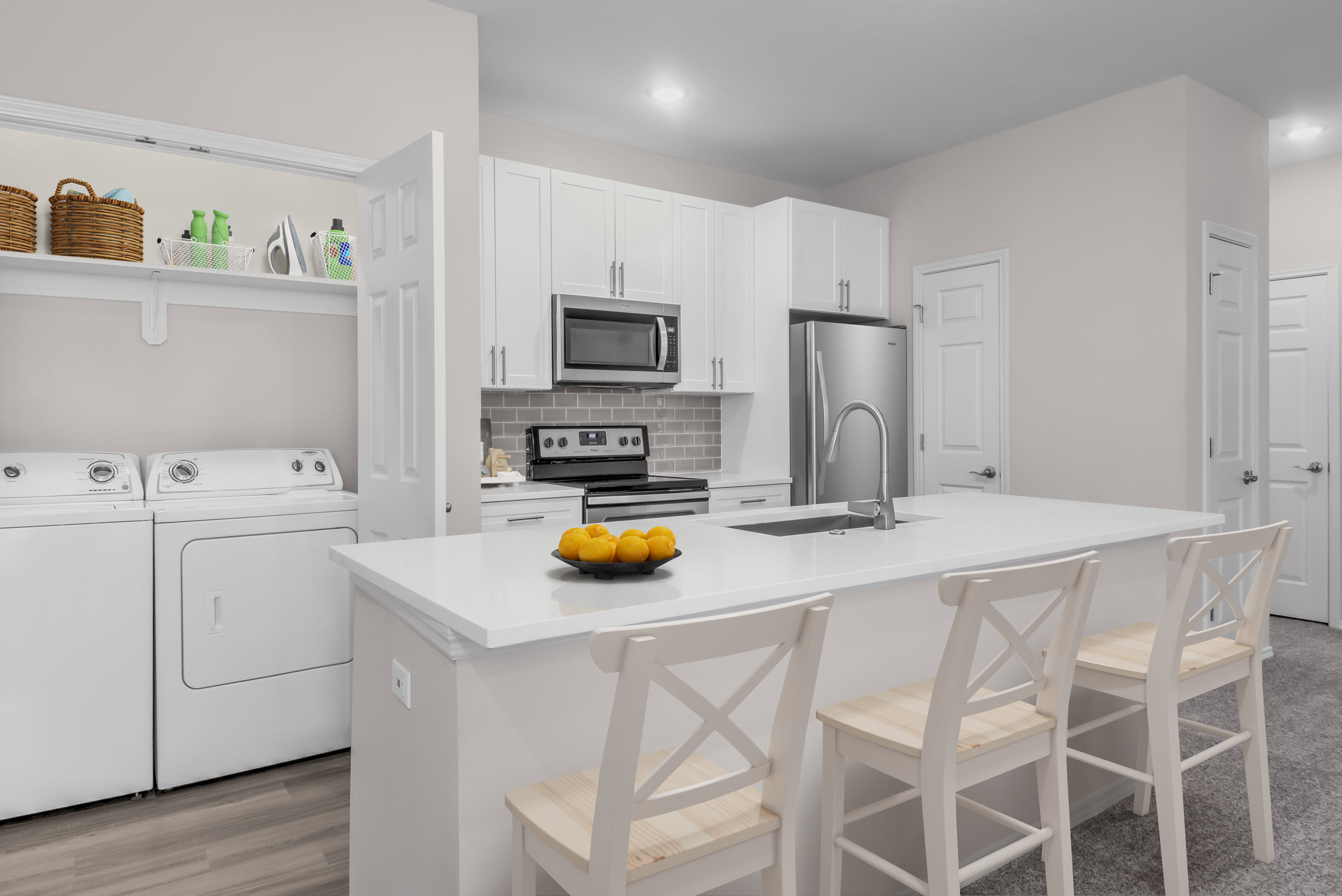 Kitchen with spacious island and full-size washer and dryer