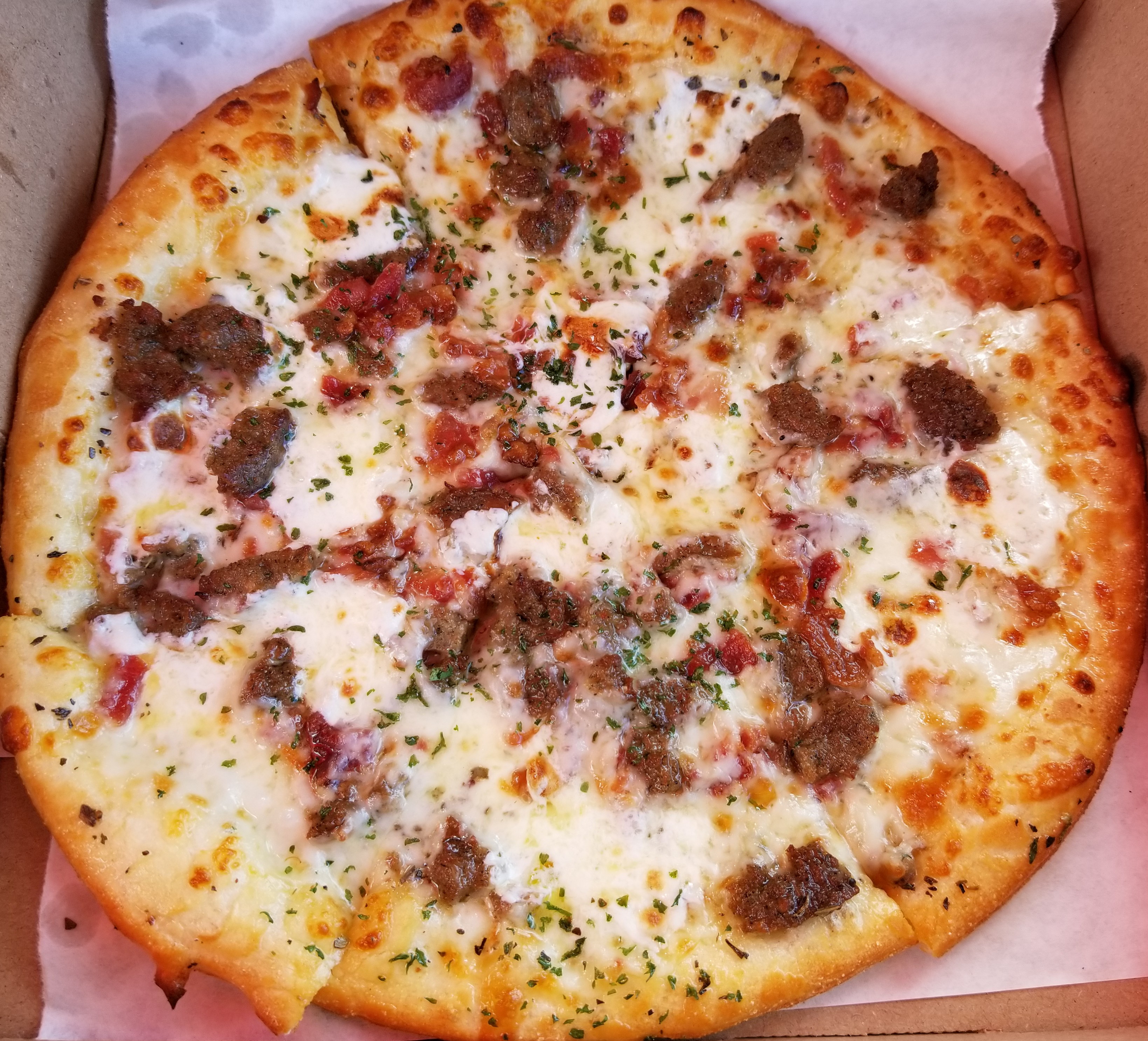 Fan Creation! Crumbled Meatballs, bacon, fresh mozzarella and extra virgin olive oil base.