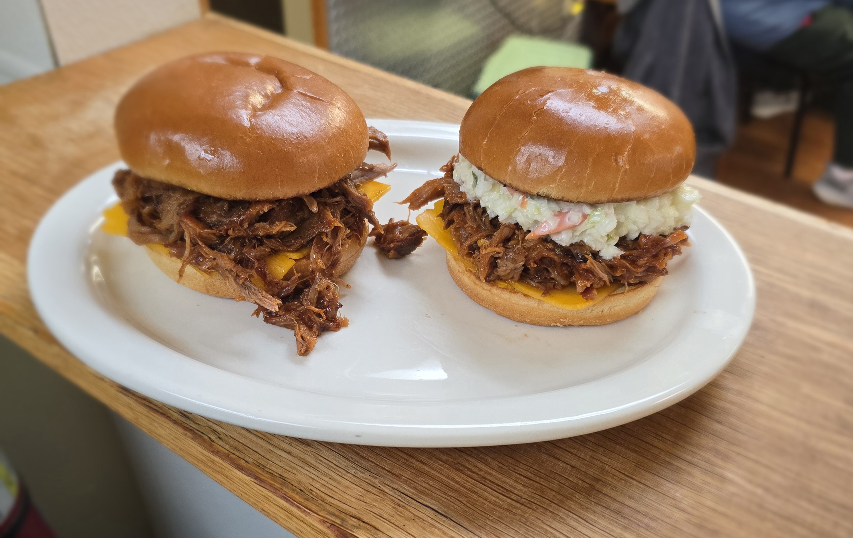 Pulled pork sandwiches with American Cheese.
