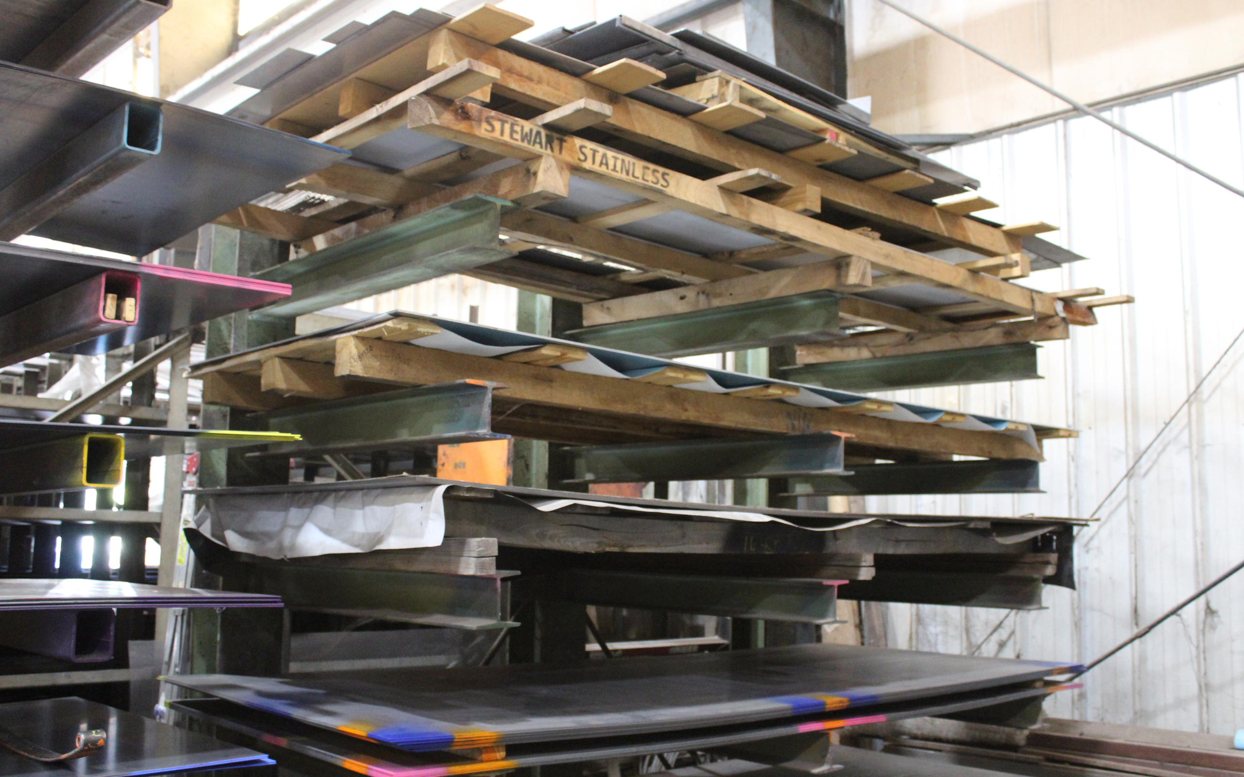 Flat steel plate inventory at Ozark Mountain Steel, stocked and organized for efficient access during custom fabrication projects. Maintaining a range of steel materials allows for faster turnaround and consistent quality on structural and custom builds.