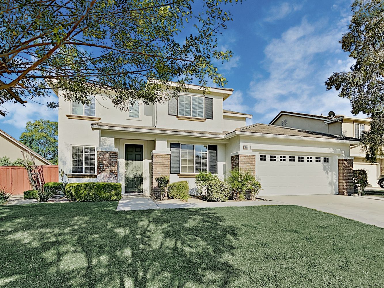 Front of house with two-car garage at Invitation Homes Pasadena.