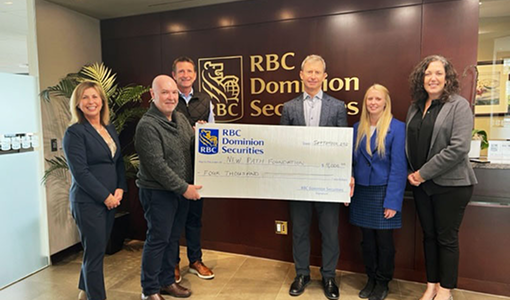 The Madison Group presenting a giant cheque to the New Path Foundation.