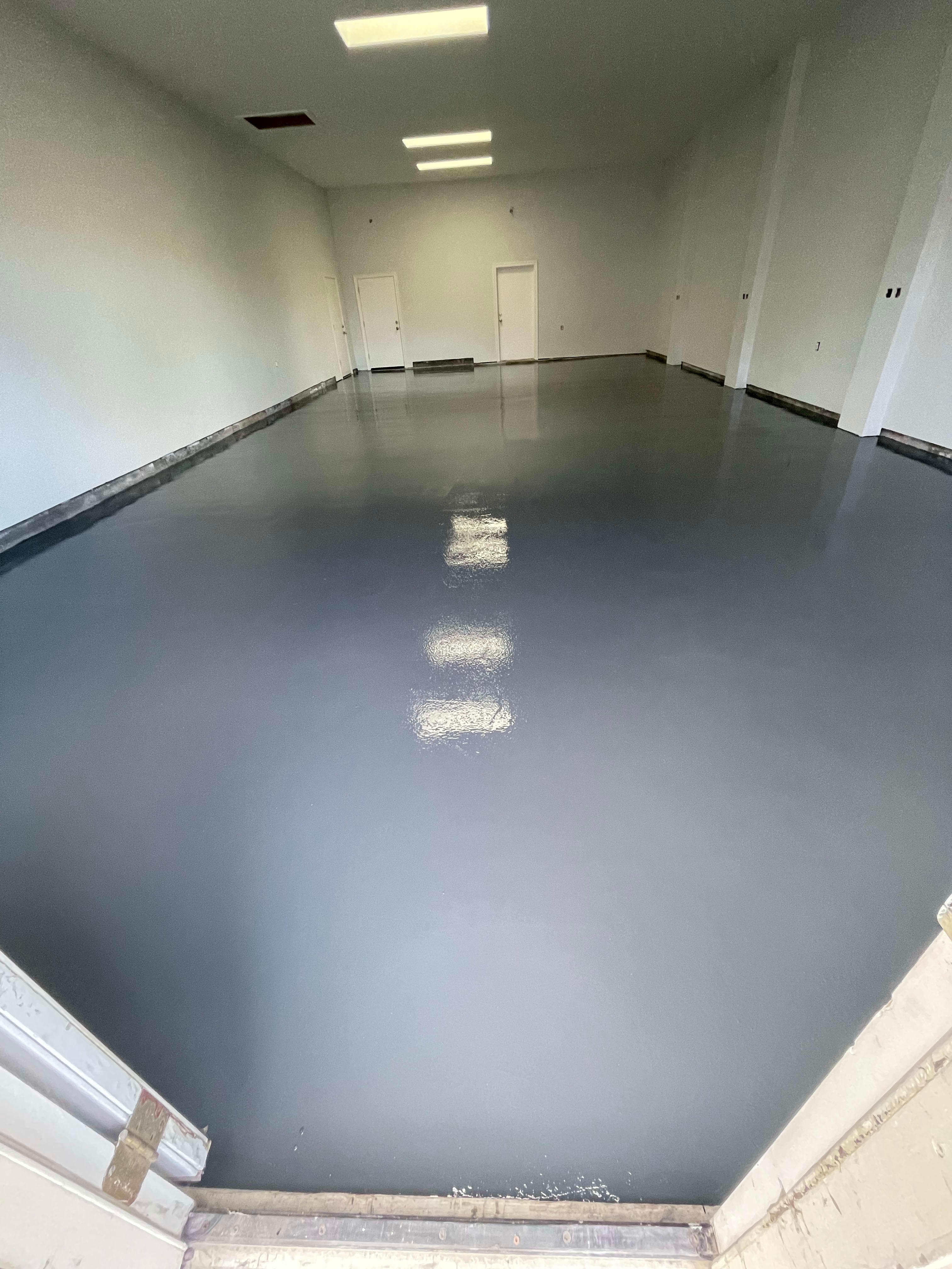 Solid epoxy flooring by Premier Garage