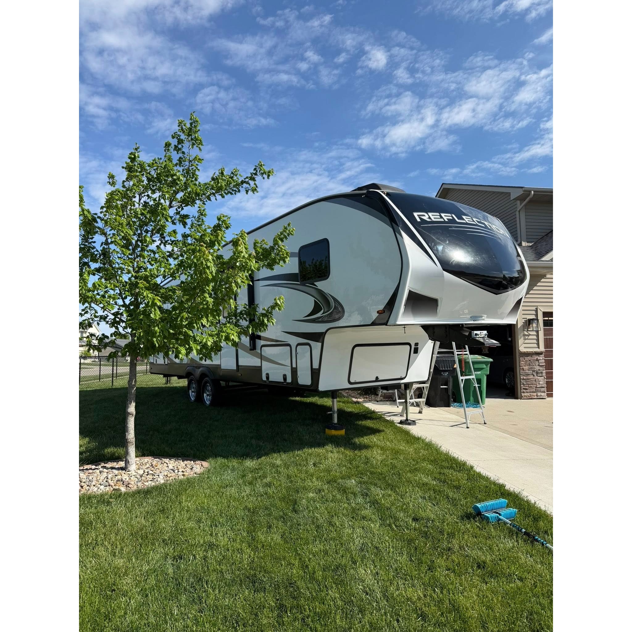 Fifth wheel RV parked at a residential property for detailing, showcasing AMT Mobile Detailing’s RV cleaning services for large campers and recreational vehicles.