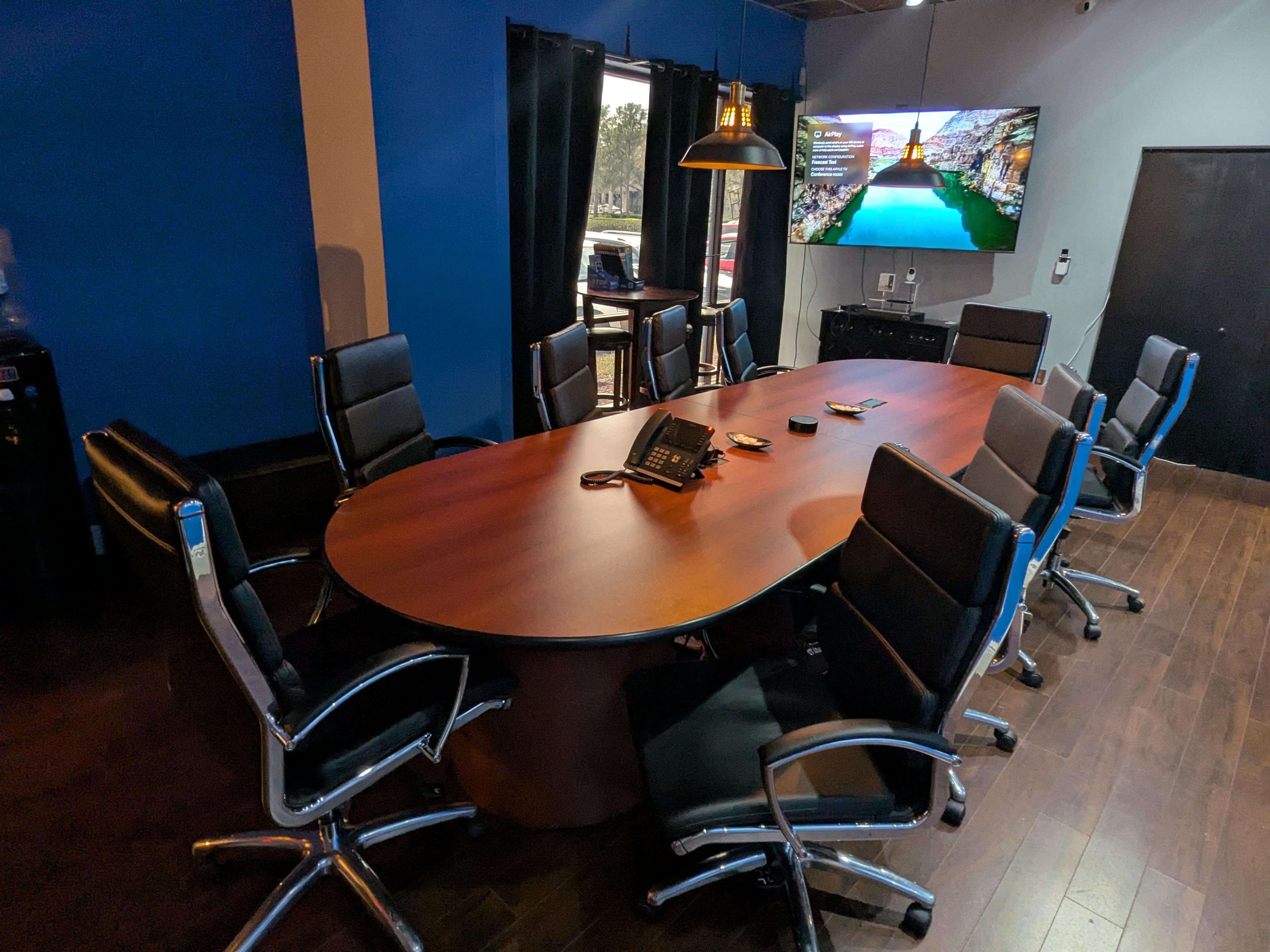 A glimpse into FreeCast, Inc.'s executive conference room, designed for high-level meetings, digital strategy planning, and media production discussions.