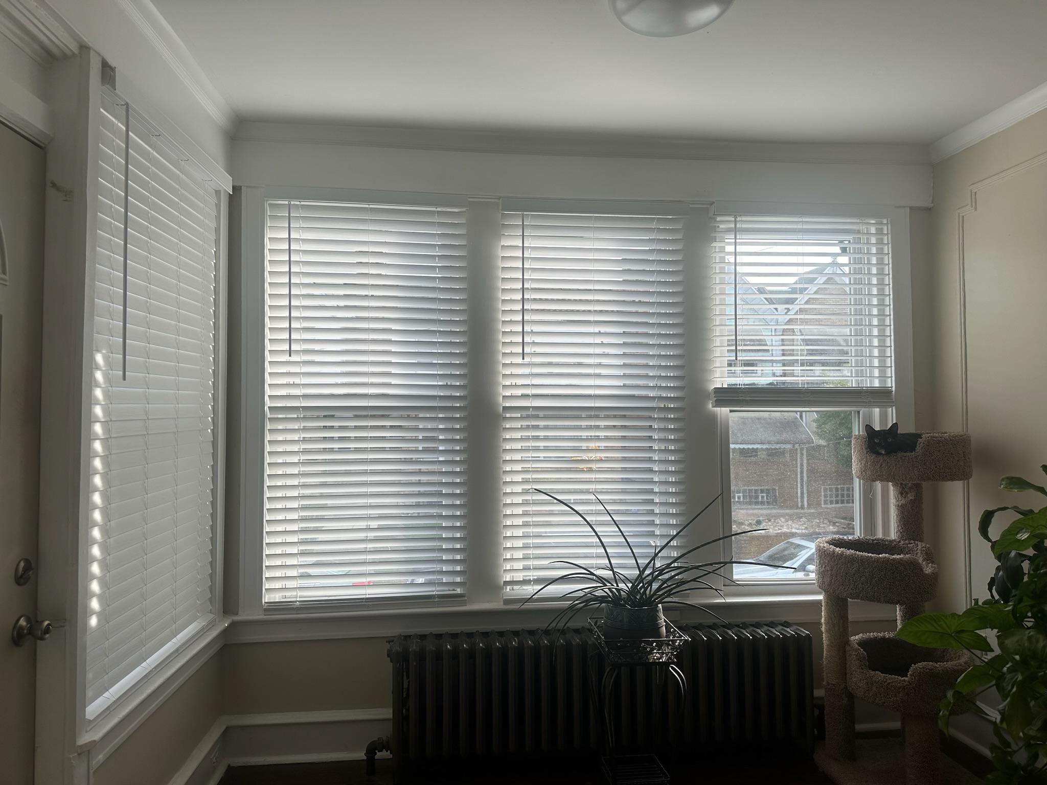 New faux wood blinds will brighten up your King of Prussia, PA living room.