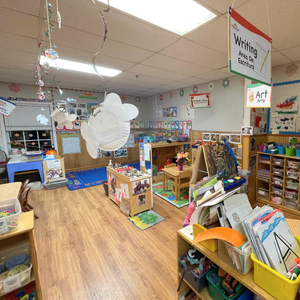 Bright and colorful preschool classroom at Childcare Network with age-appropriate learning materials