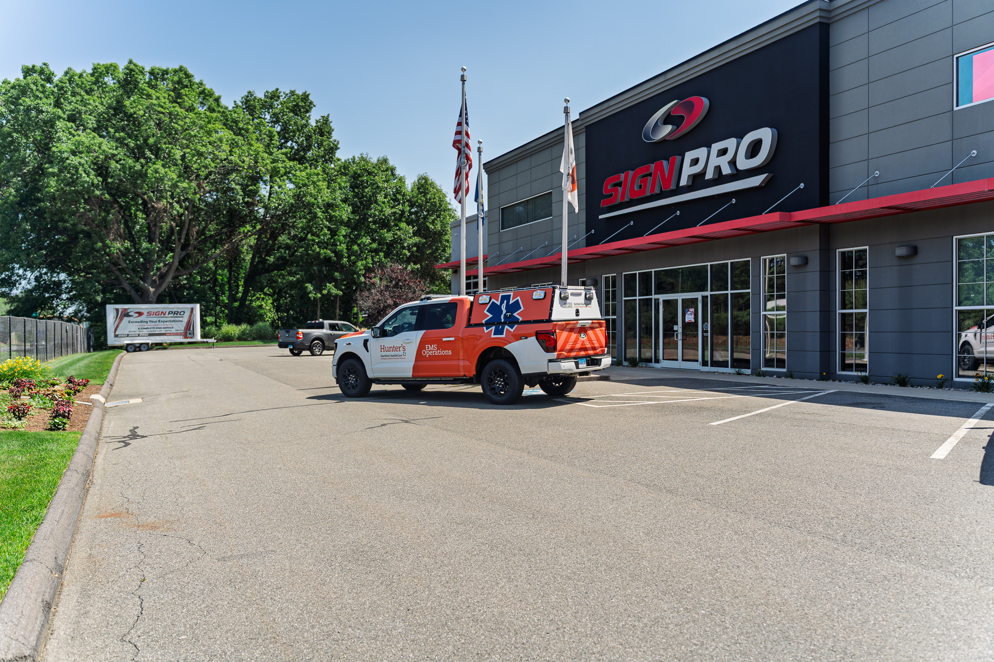 Custom EMS Operations vehicle wrap designed, fabricated, and installed by Sign Pro for Hunter's Ambulance, part of the Hartford HealthCare Emergency Medical Services Network.