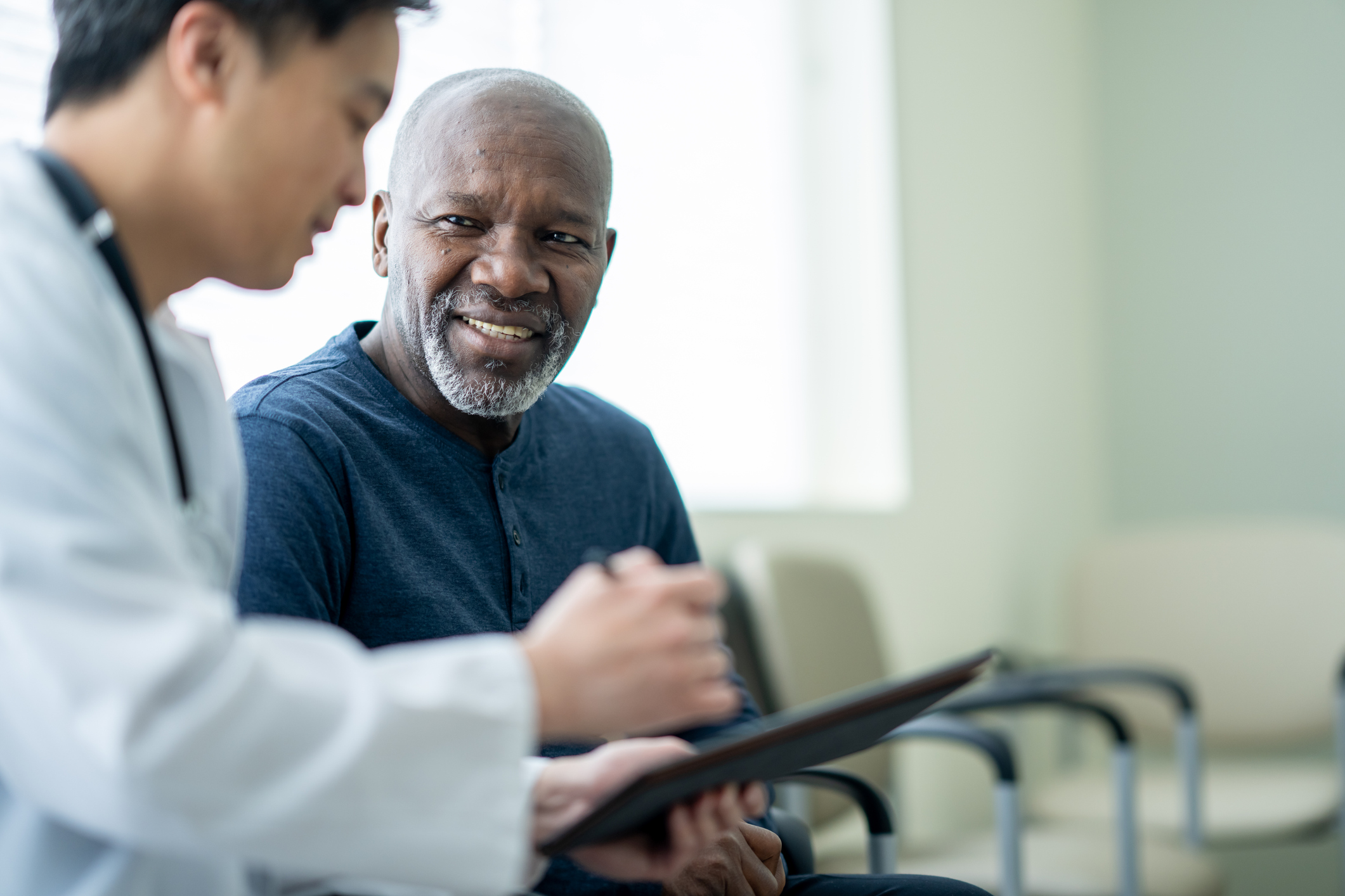 Physician discussing treatment plan with patient