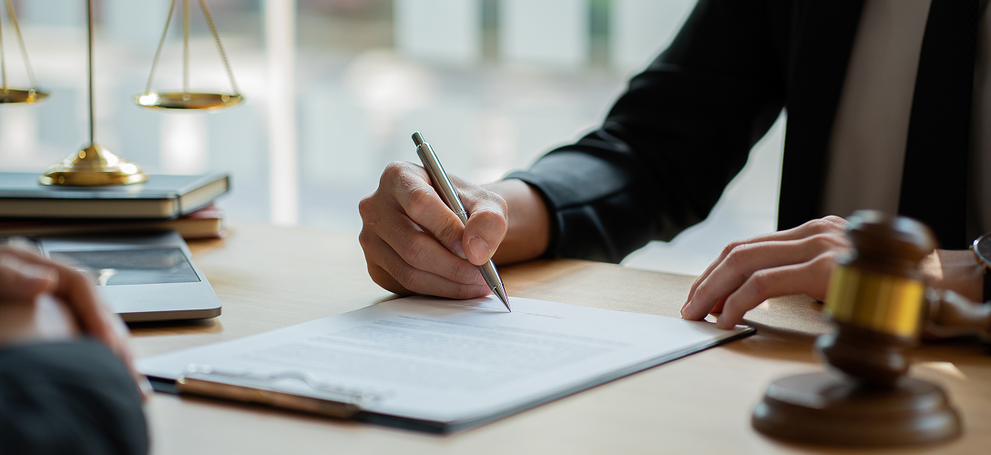 A person writing on a clipboard.