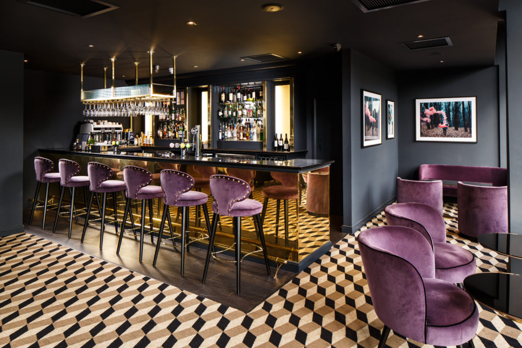 Bar area with purple bar stools at Mercure Edinburgh City Princes Street Hotel. Mercure Edinburgh City Princes Street Hotel Edinburgh 01313 421013
