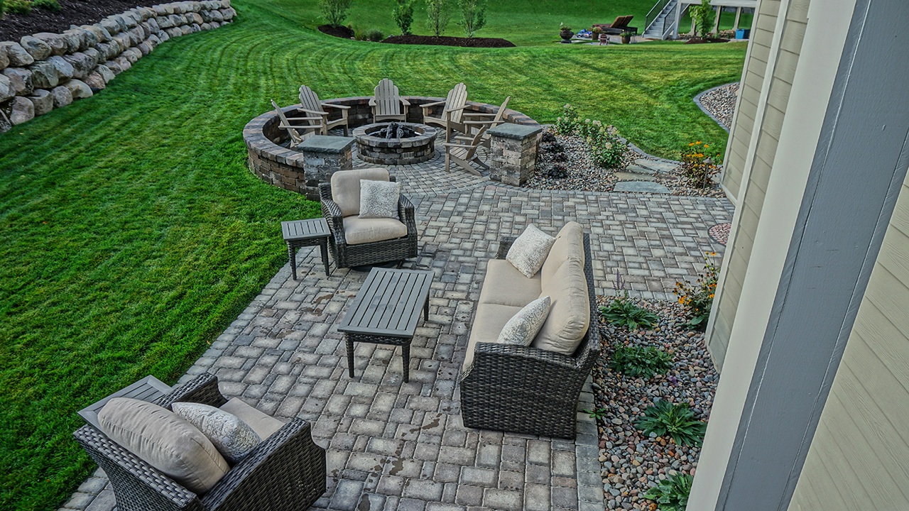 At Greenscape Companies, we offer construction and installation for all types of fire pits and fireplaces, including: patio, gas insert, wood-burning, raised, and our door fire pits.