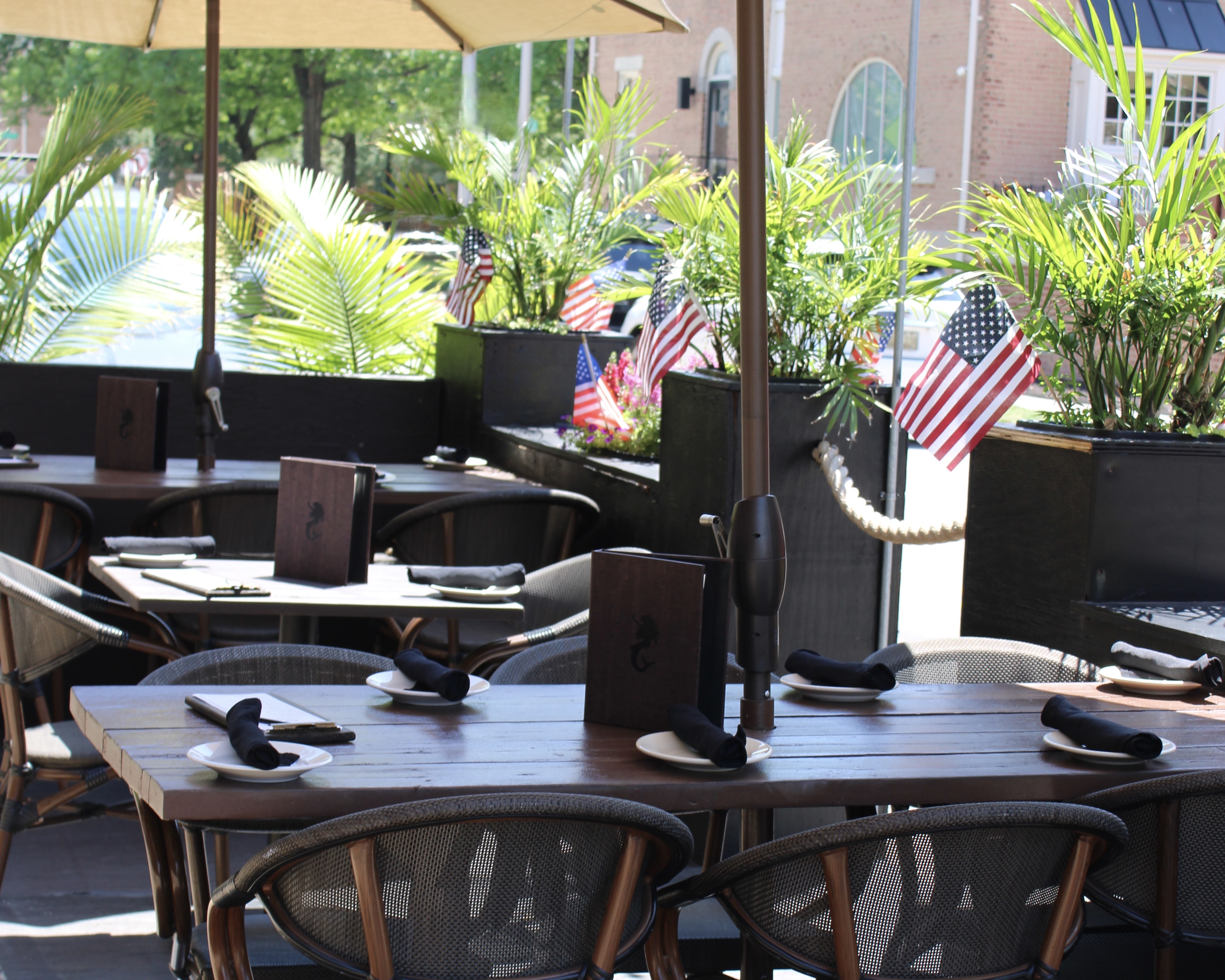 Mama's On The Half Shell Baltimore Outdoor Dining Area dressed in American flags for Fourth of July 