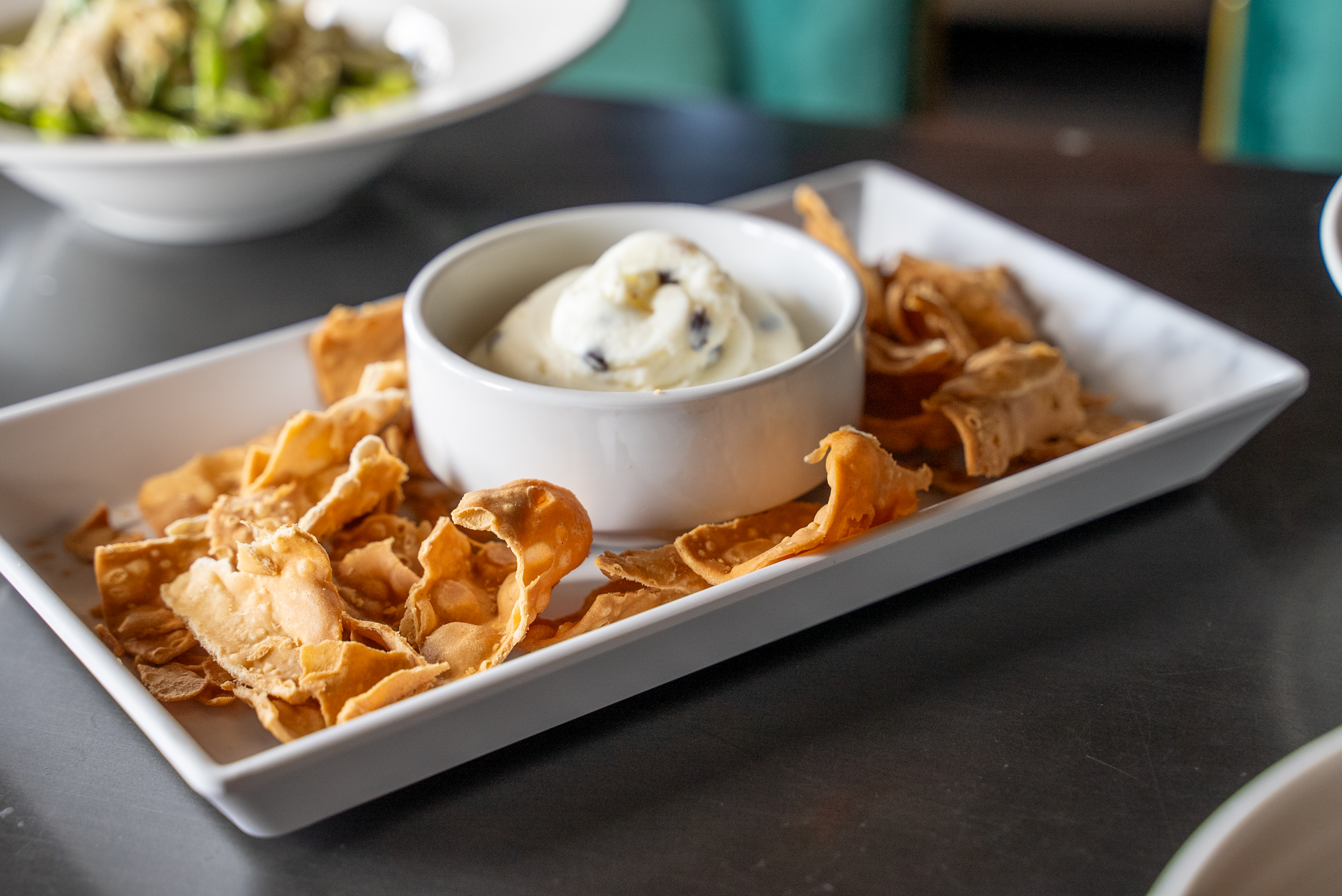Light airy cannoli chips with the traditional filling as a dip.