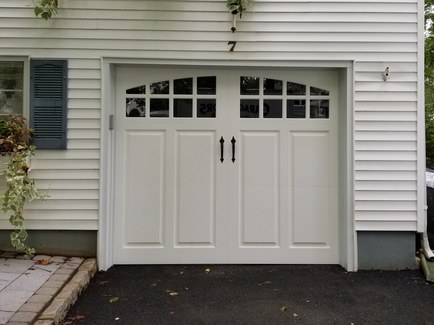 Garage Door PR12-A with Curved Windows and Decorative Handles