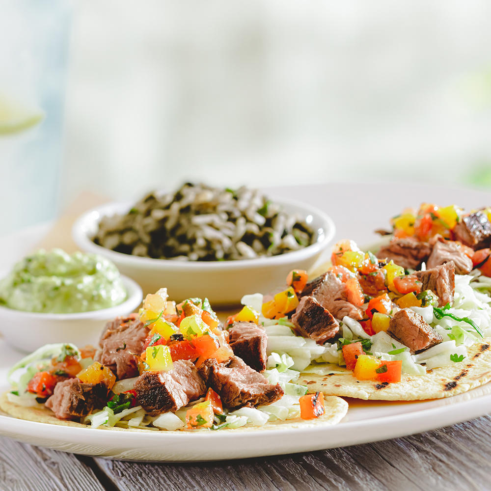 Wood-grilled Steak Tacos-pico de gallo, avocado-lime crema, rice and beans