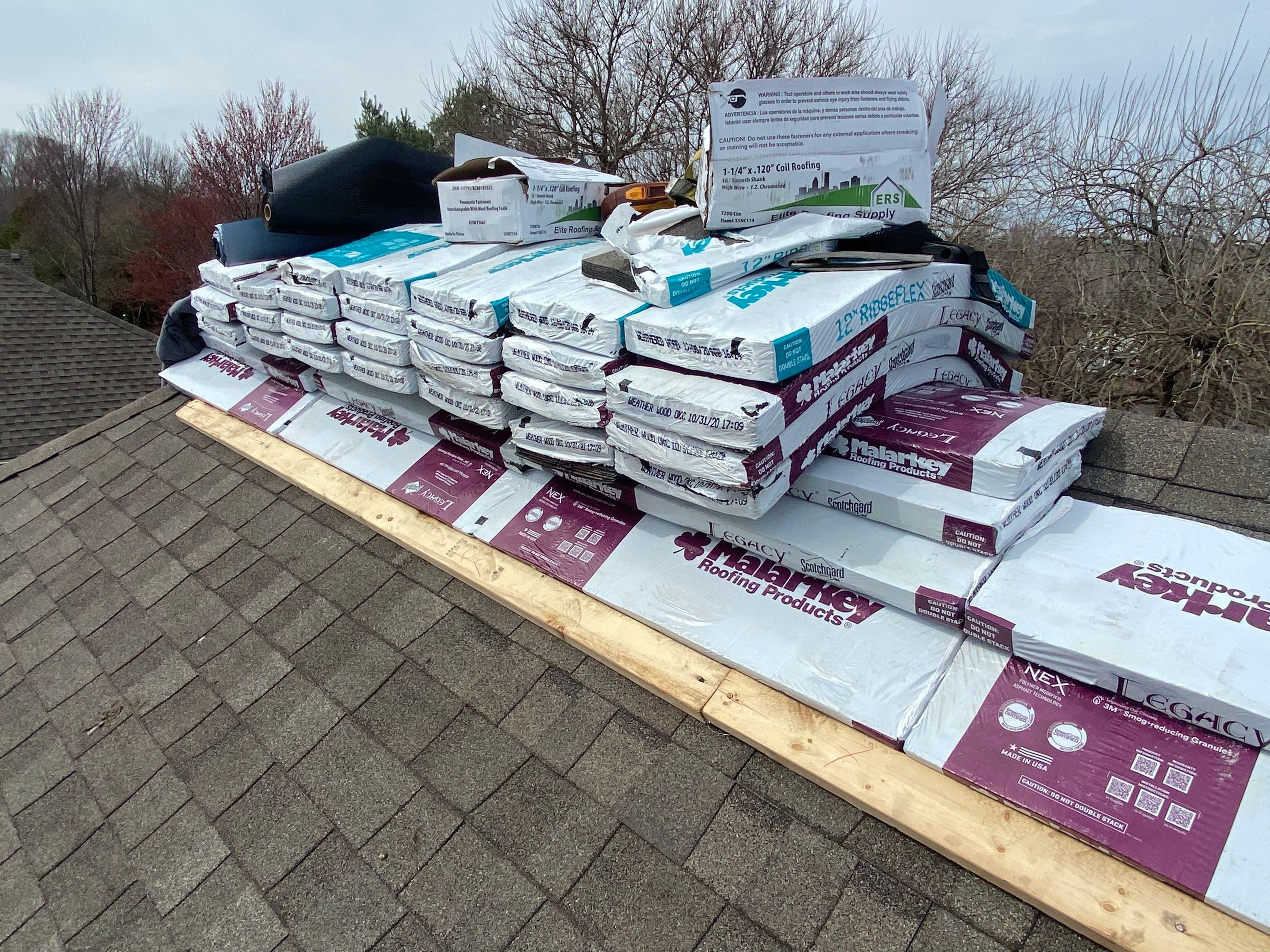 Malarkey-Roofing-Products-Stacked-On-A-Roof-True-Grit-Construction
