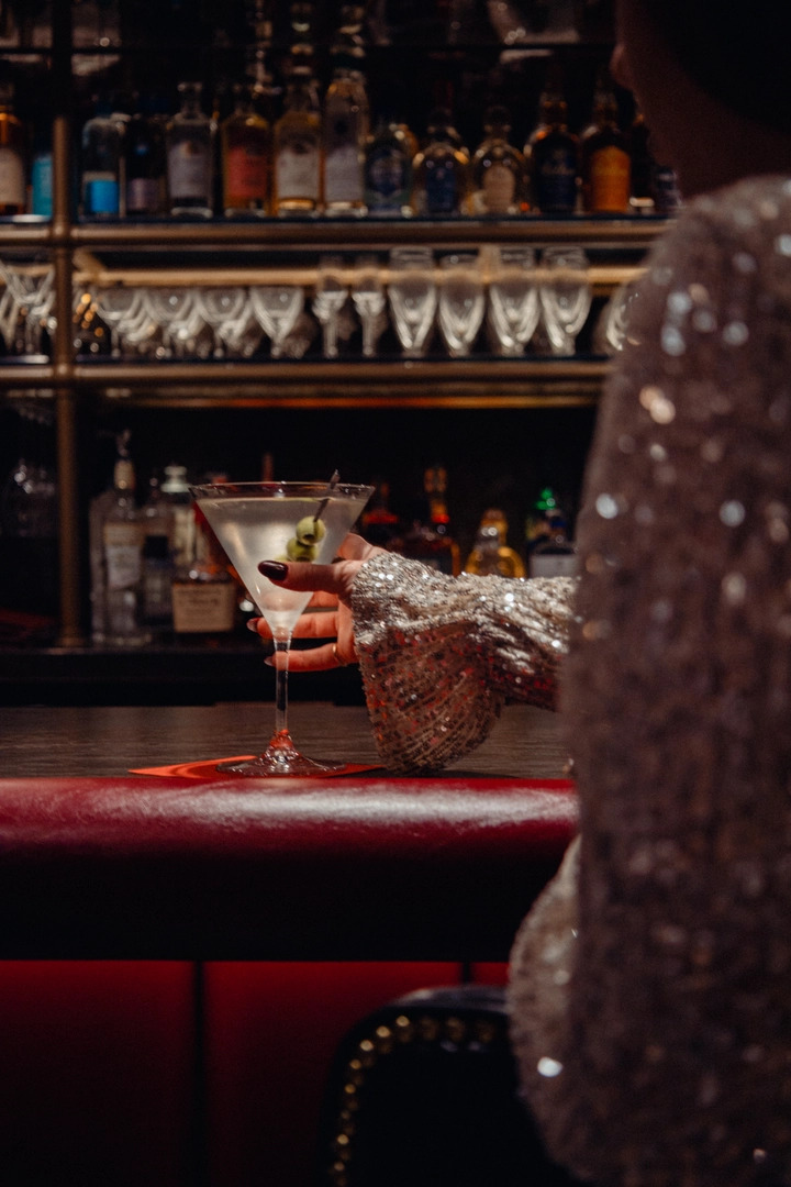 Woman having a martini at Durant's bar