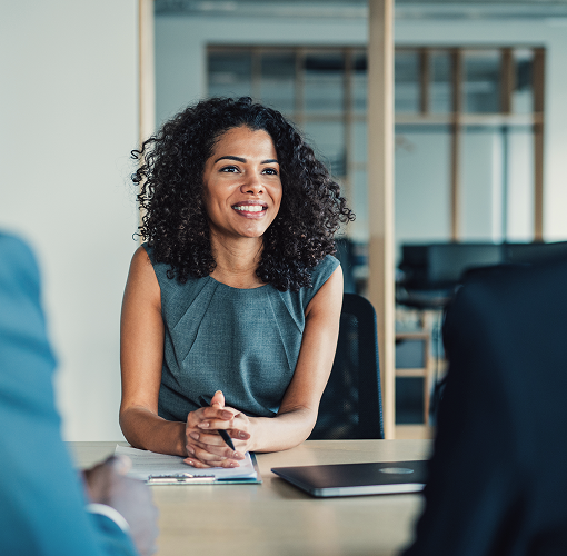 A woman meeting with her clients.
