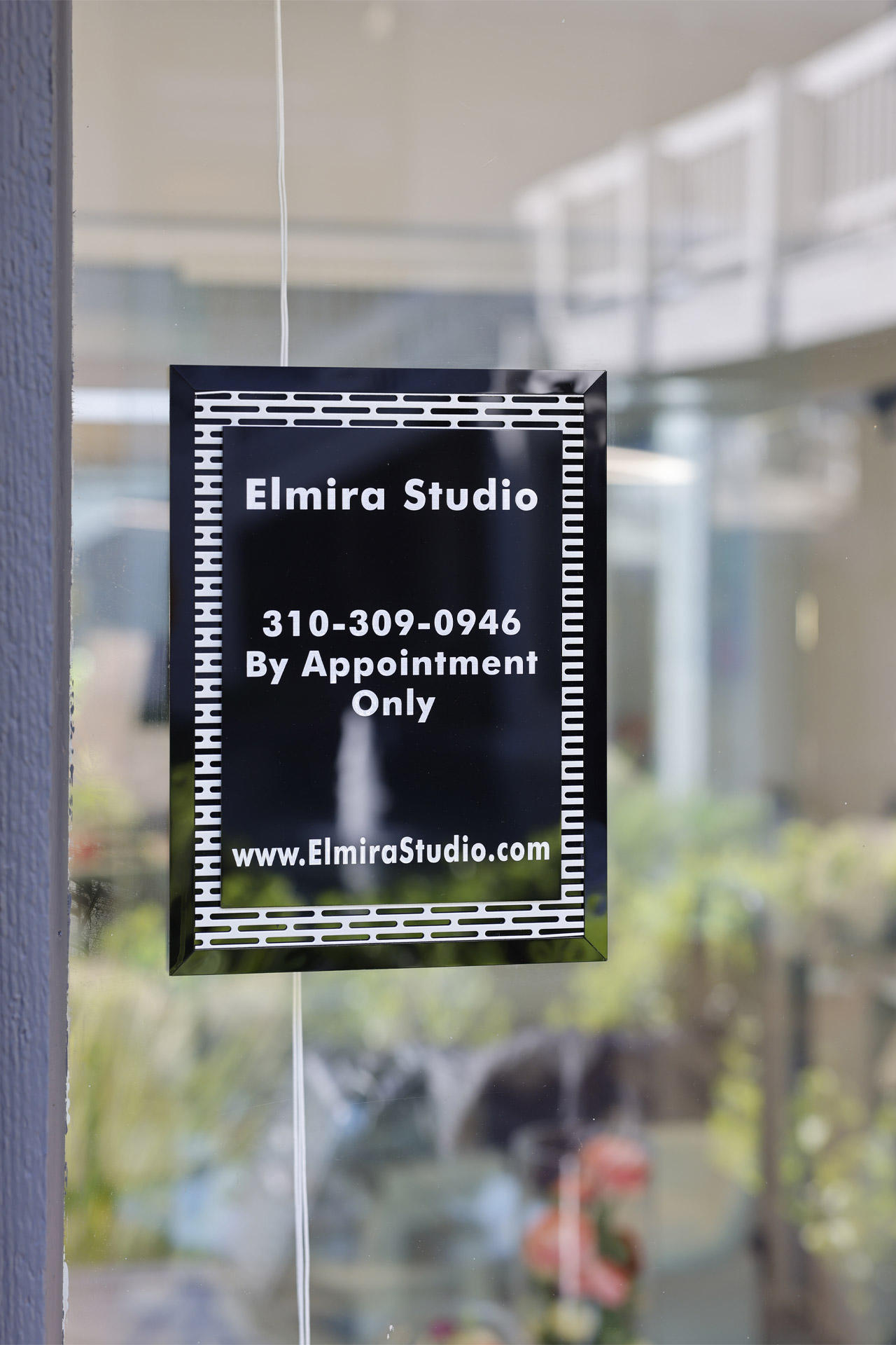 Sign Outside of Elmira Studio. Book your appointment today.