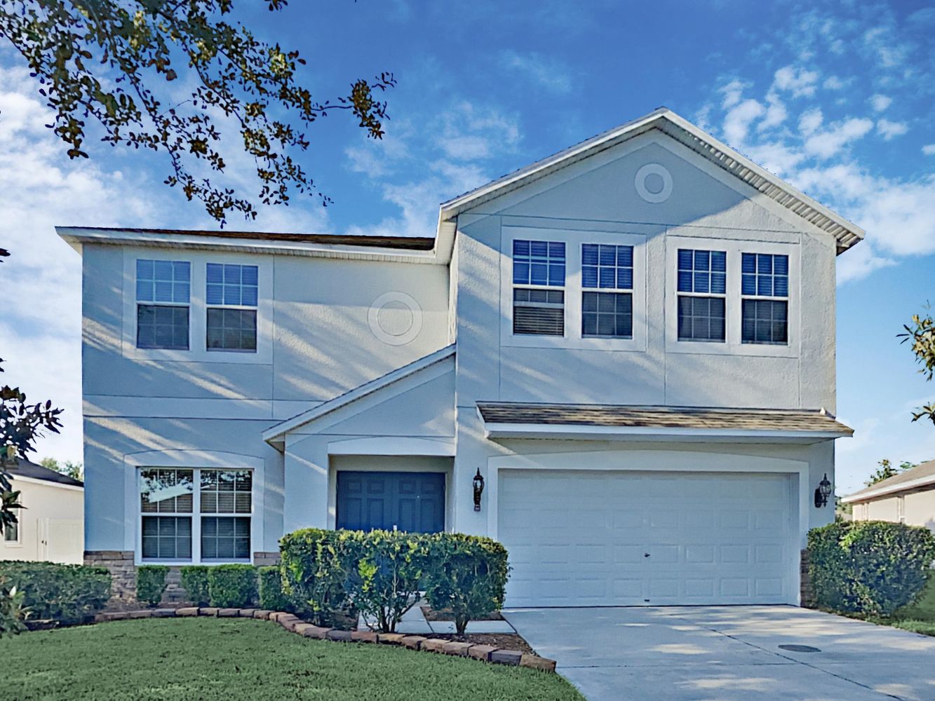 Front of home with two-car garage at Invitation Homes Tampa.