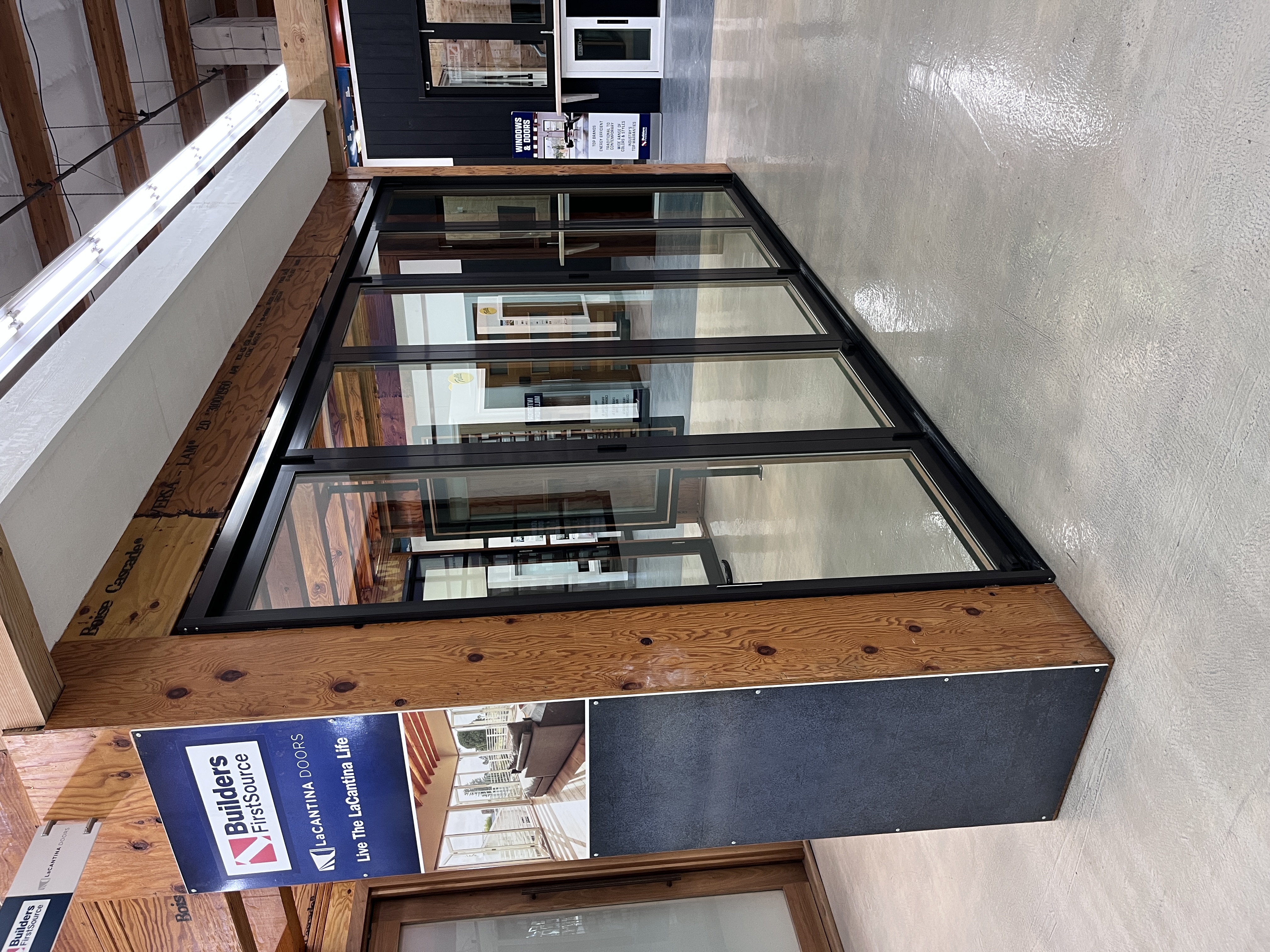LaCantina multi-panel folding glass door display at Builders FirstSource Thousand Oaks, CA, shown in the windows and doors showroom section.