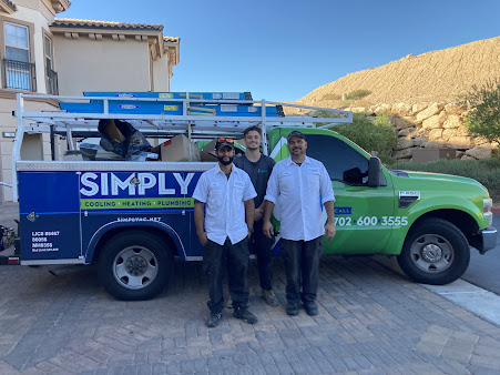 Simply Cooling, Heating and Plumbing Technicians In Front Of Job Site 