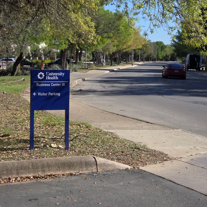 Visitor parking sign off Farinon Drive at Business Center 3