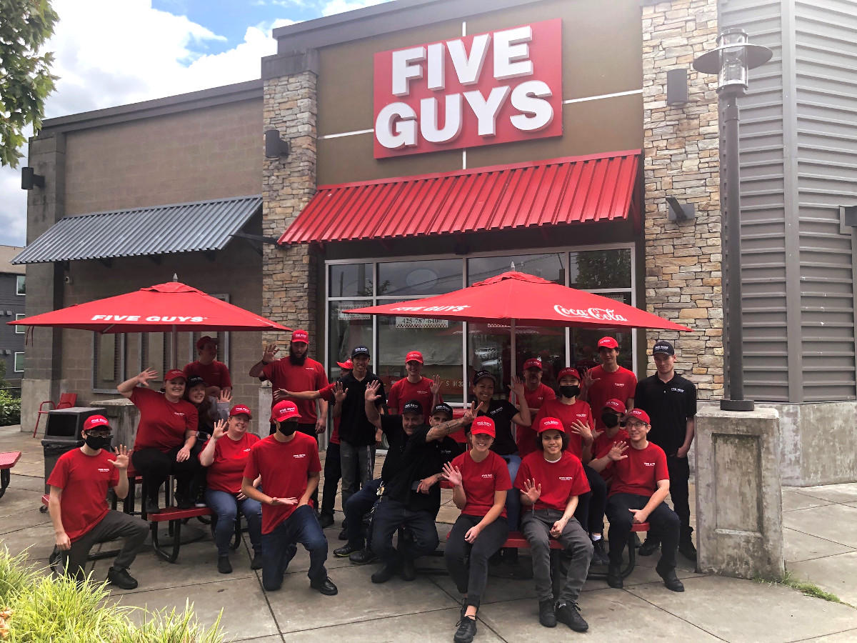 Five Guys crew members pose in front of store at 2902 164th Street SW in Lynnwood, Washington.