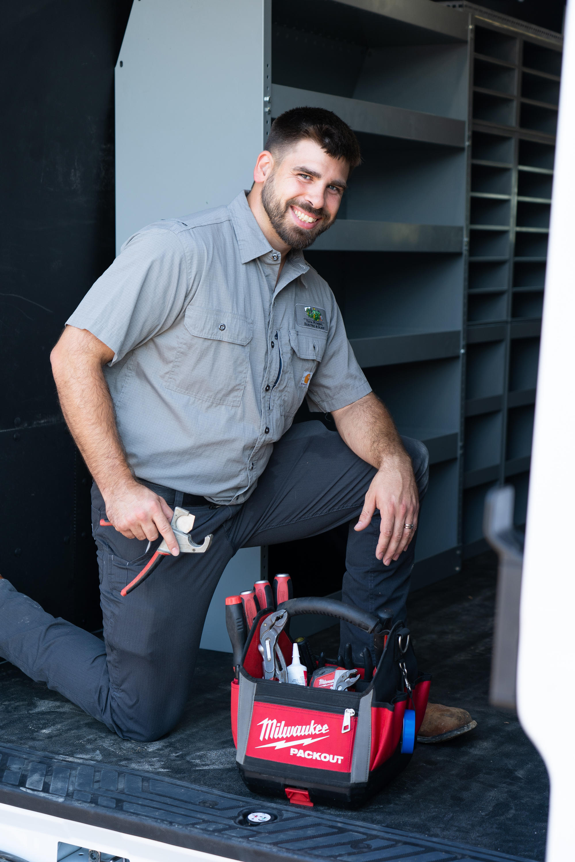 A skilled Tioga Contractors plumber with his tool bag ready for plumbing service calls in the Bedford, TX area.