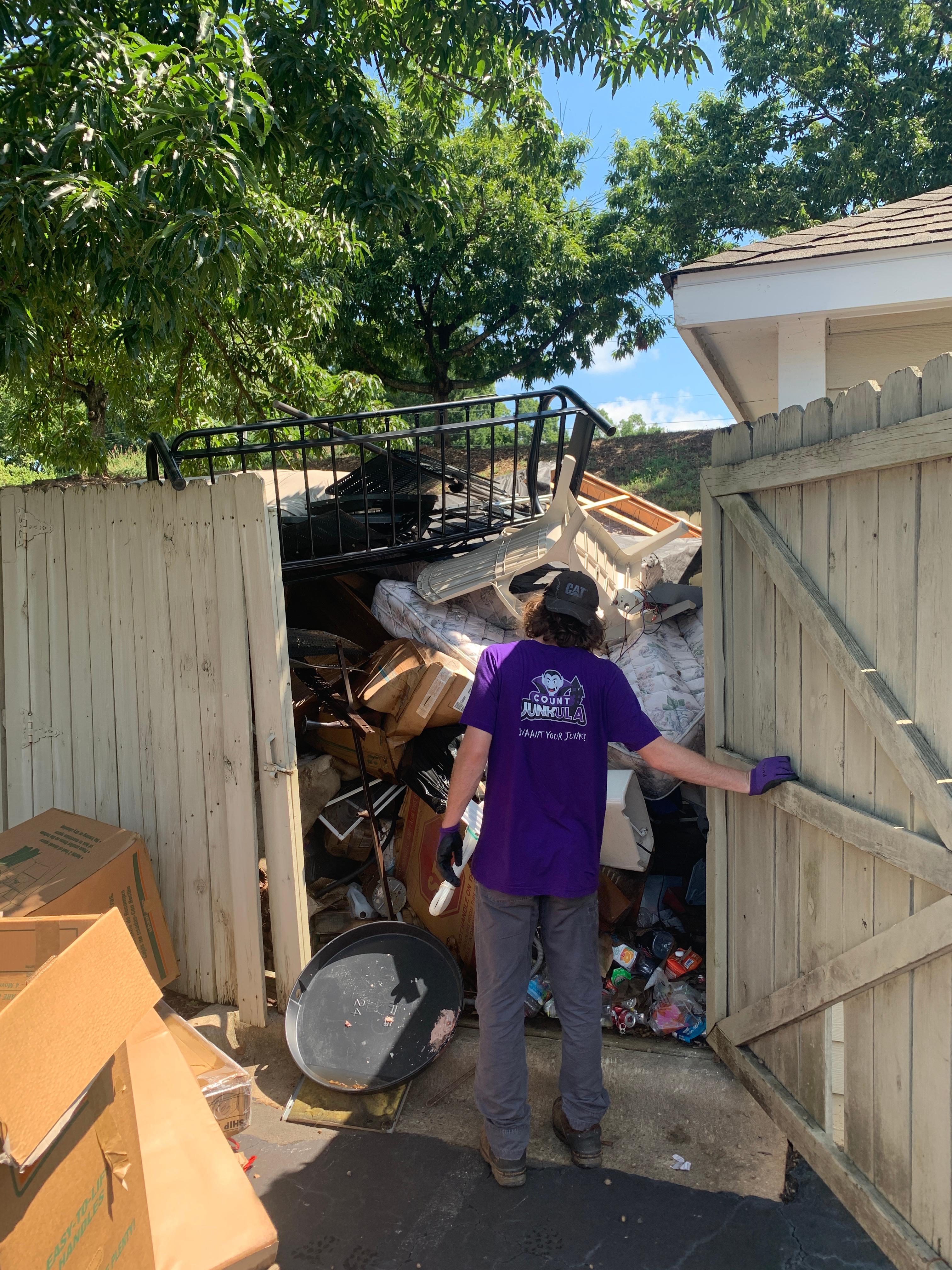 count junkula of raleigh junk removal crew member at work