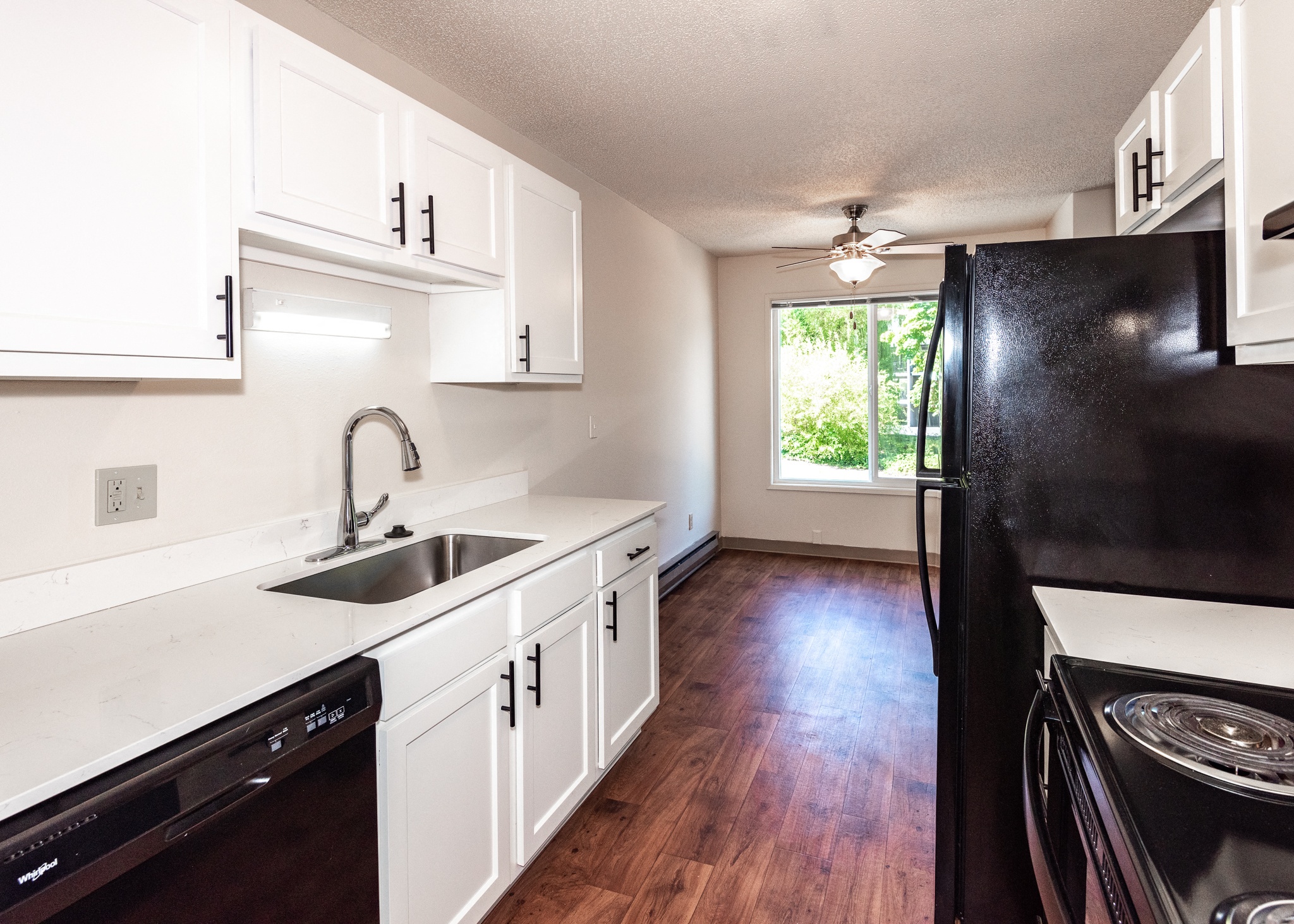 Kitchen With Black Appliances 