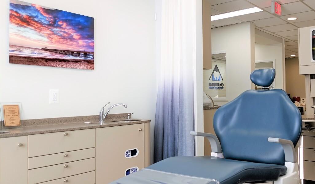 Dental chair and coastal artwork in a treatment room at our Springfield office.
