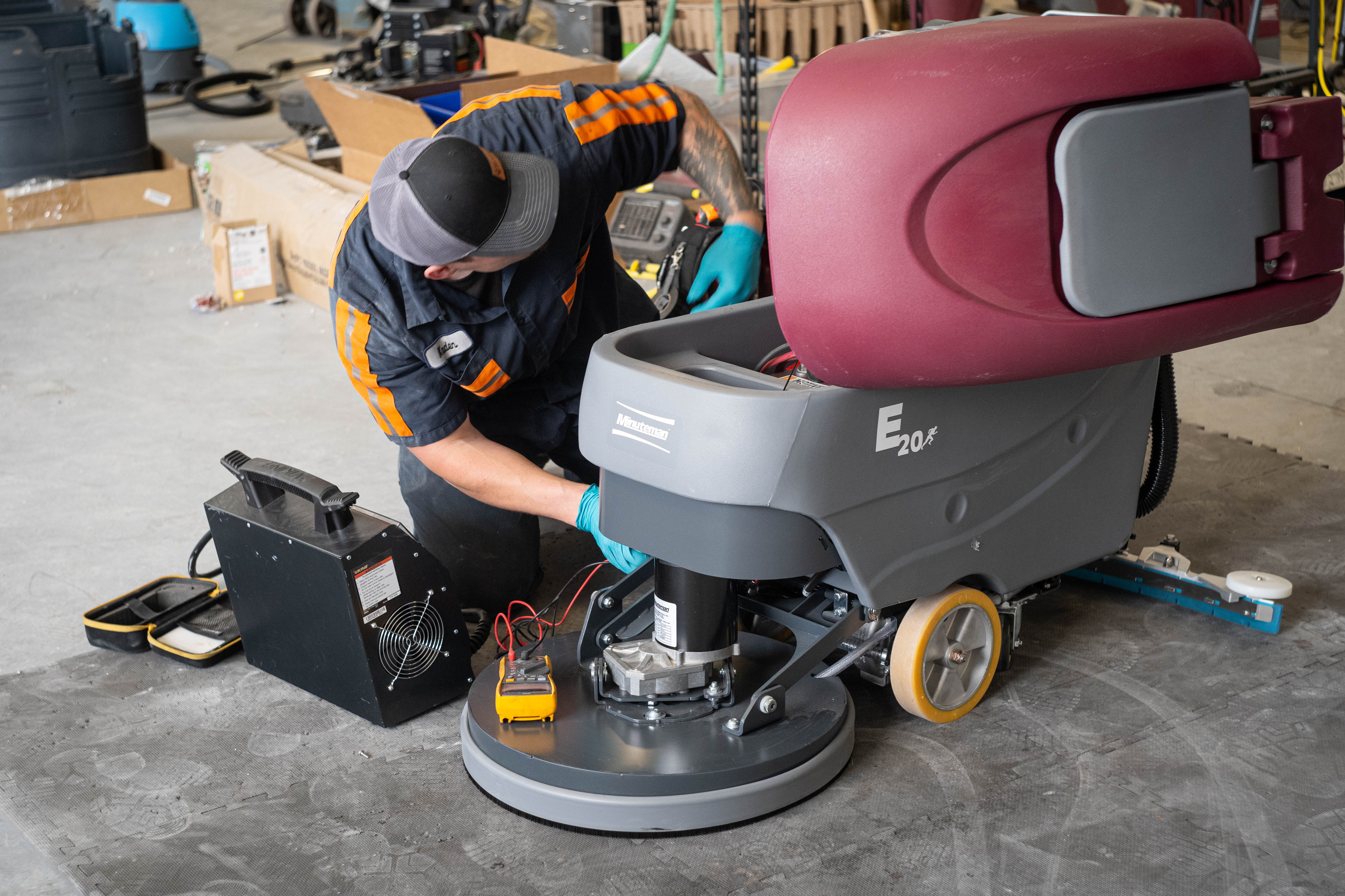 WaySolutions lead technician Kaden conducts heavy-duty battery load testing and motor diagnostics on a Minuteman E20 walk-behind floor scrubber. Serving facilities in Layton, Utah, we use industrial testing equipment to guarantee your cleaning fleet has the endurance to survive the toughest shifts.