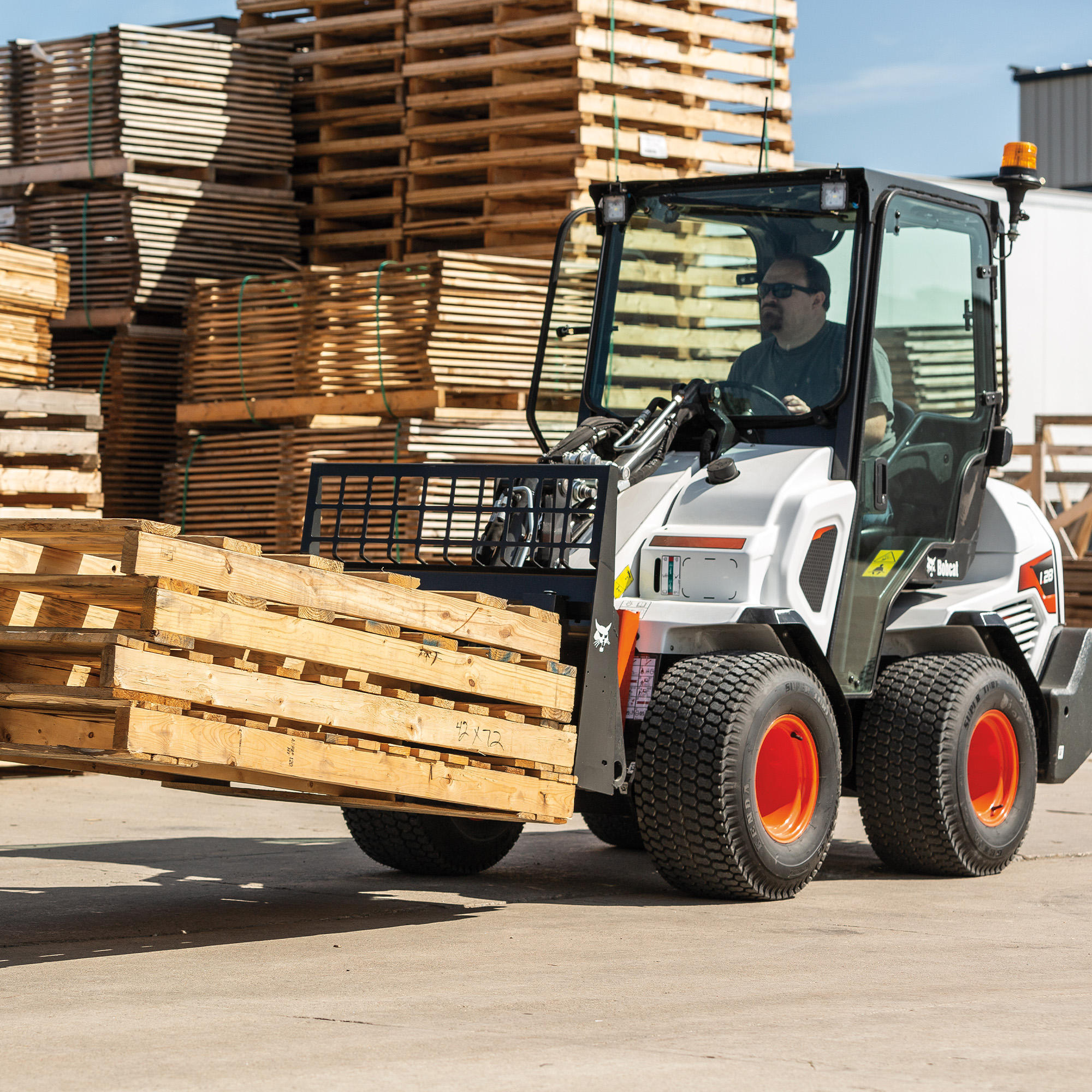 A Bobcat L28 small articulated loader with pallet fork attachment Paul Equipment Fredericton (506)449-3289