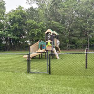 Safe, fenced playground area at Childcare Network where children enjoy active outdoor play