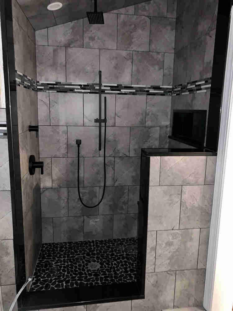 We installed a new shower, custom tile, and a custom seat for this bathroom remodel in Danville, New Hampshire.