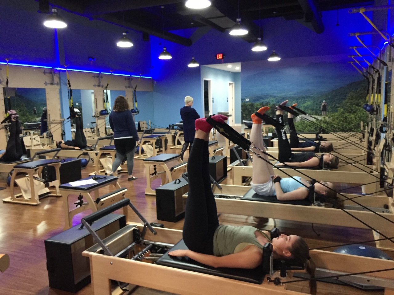 Feet in Straps in our Level 1.0 Reformer Flow Class