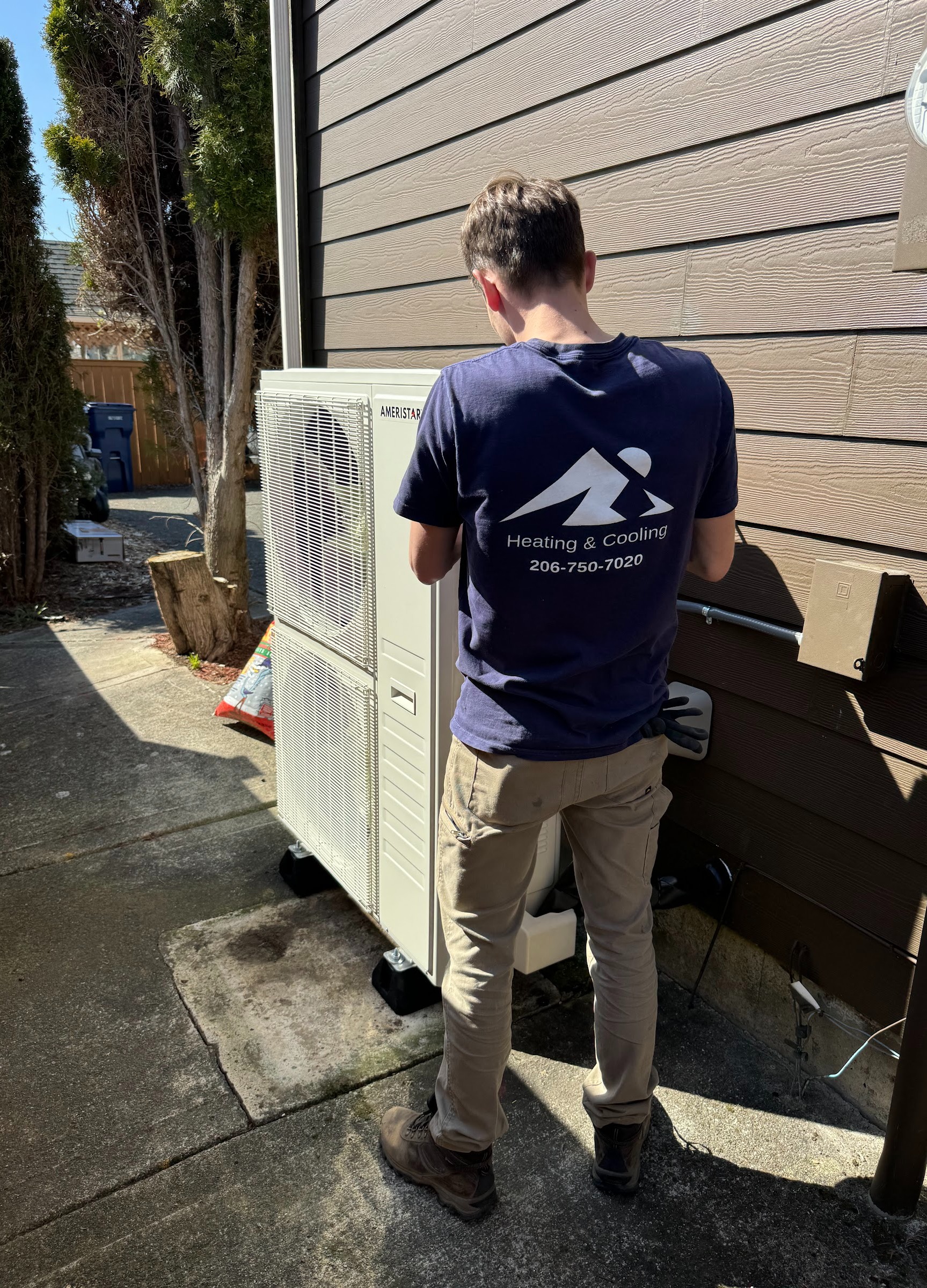 Ready Energy Solutions technician working on a Mitsubishi heat pump outdoor unit. Mitsubishi Diamond Contractor for heat pump installation and repair.