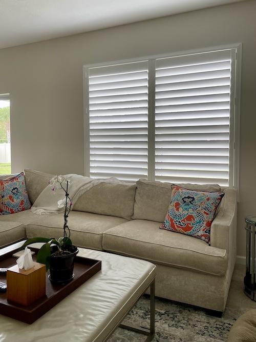 Check out these gorgeous custom shutters we installed locally in Vero Beach. They allow just the right amount of sunlight to brighten this beautiful living room, all while providing essential privacy.