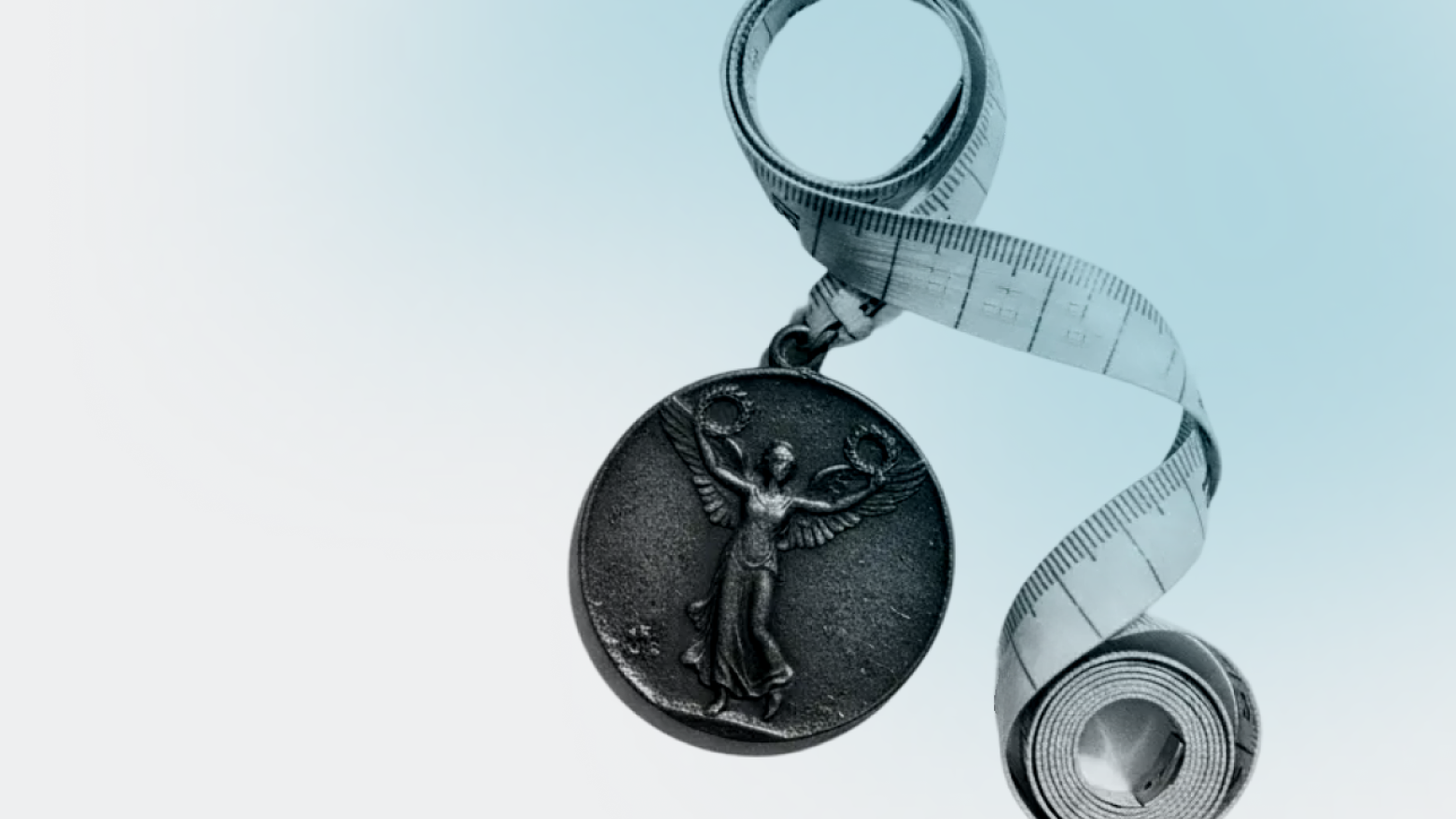 A metal medal with a winged figure hangs from a curled measuring tape against a light blue background, symbolizing achievement and measurement.