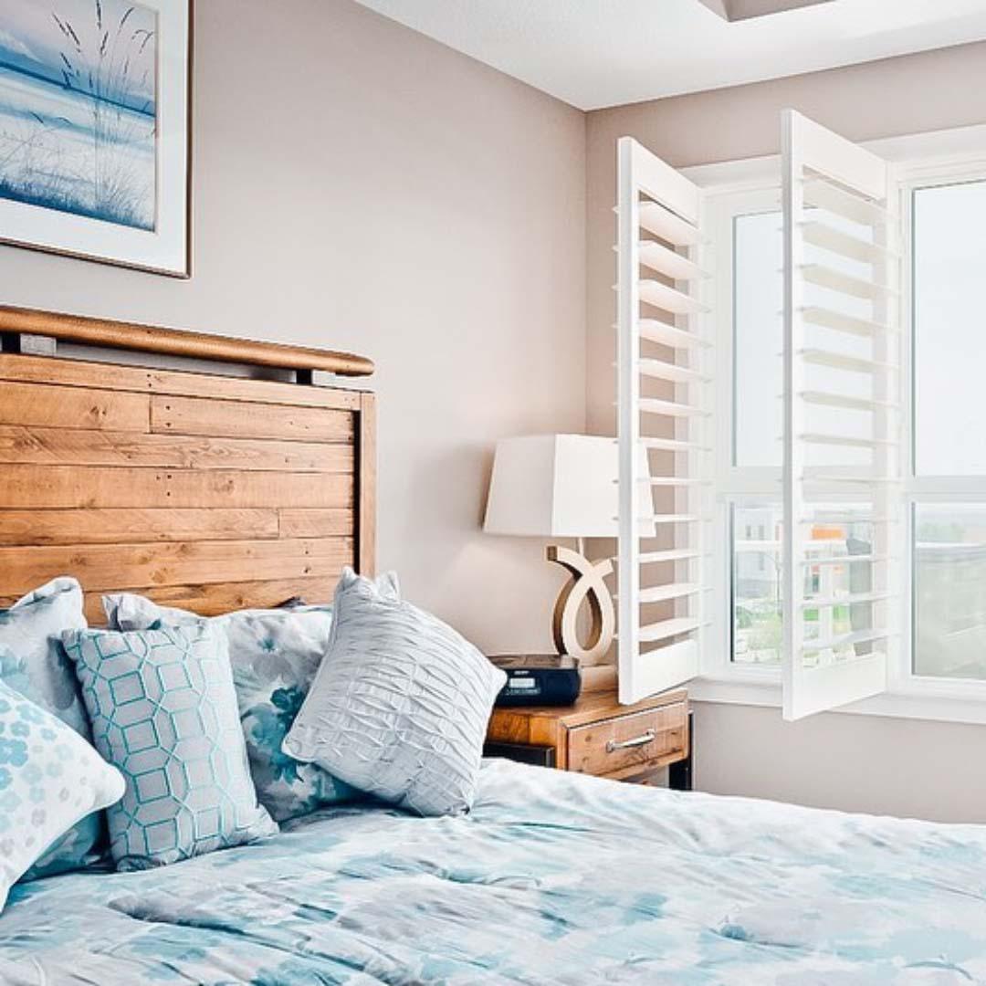 Shutters are a beautiful addition to this bedroom. Budget Blinds of Chilliwack, Hope and Harrison Chilliwack (604)824-0375