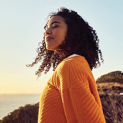 Woman is thinking about AudioNova's solutions for her tinnitus in St Clair Shores, MI