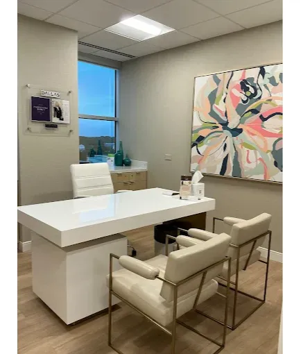 Private consultation room for Women’s Wellness Institute of Dallas and cosmetic gynecology services, designed for comfortable, confidential patient care and personalized treatment discussions.