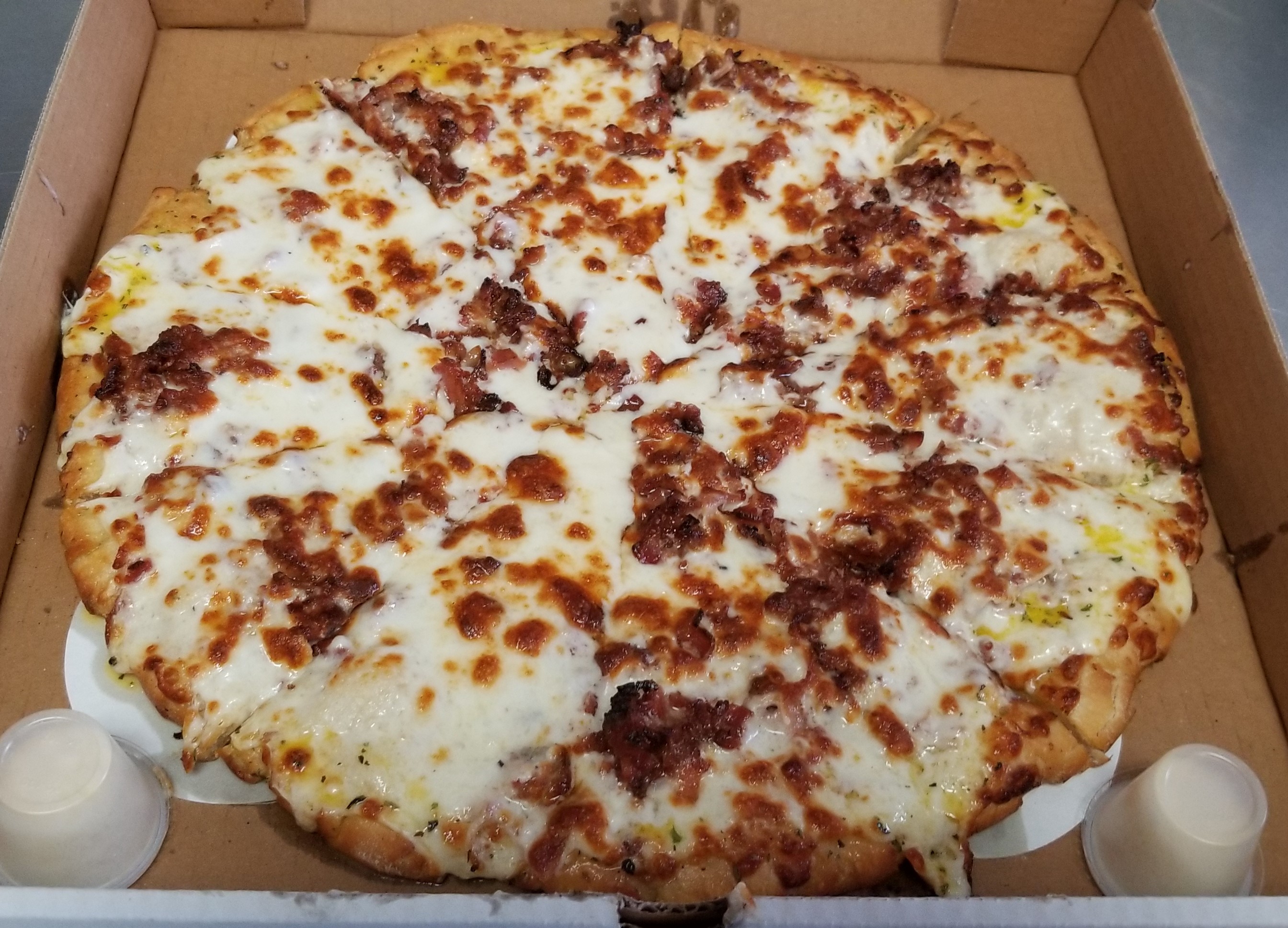 Fan Creation with alfredo sauce, fresh mozzarella and extra bacon crumbles!