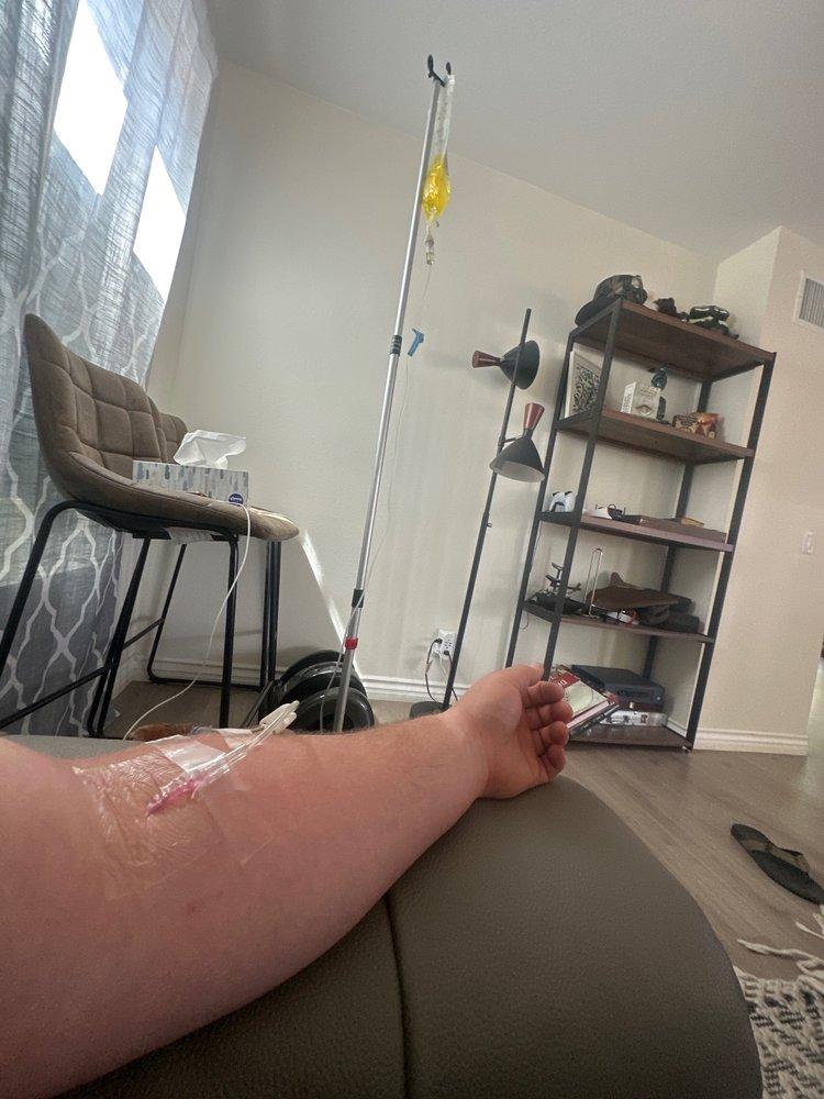 Person receiving mobile IV therapy at home in Los Angeles for hydration and recovery.
