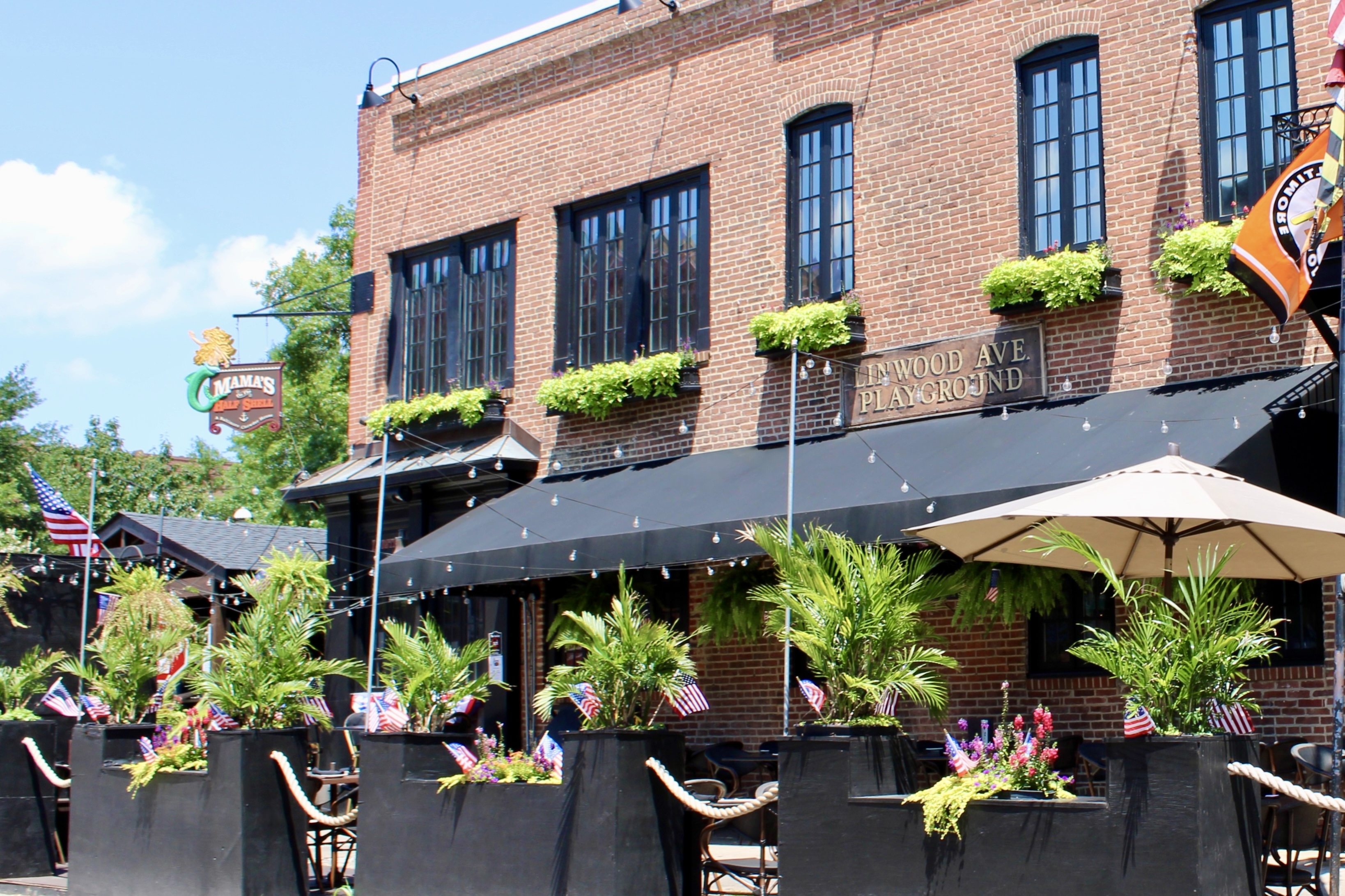 Mama's On The Half Shell Baltimore Outdoor Dining Area dressed in American flags for Fourth of July 