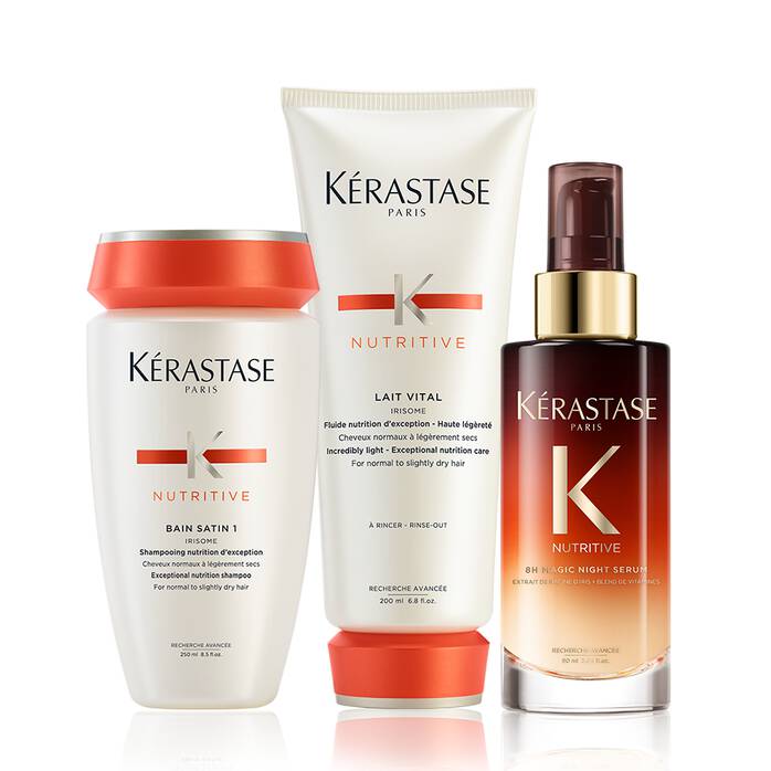 Three Kérastase hair products are displayed against a white background. From left to right, there is a white bottle with an orange cap labeled "Bain Satin 1", a white tube labeled "Lait Vital", and a dark amber glass bottle with a gold pump dispenser labeled "8H Magic Night Serum". All products feature the Kérastase logo and "Nutritive" line branding.