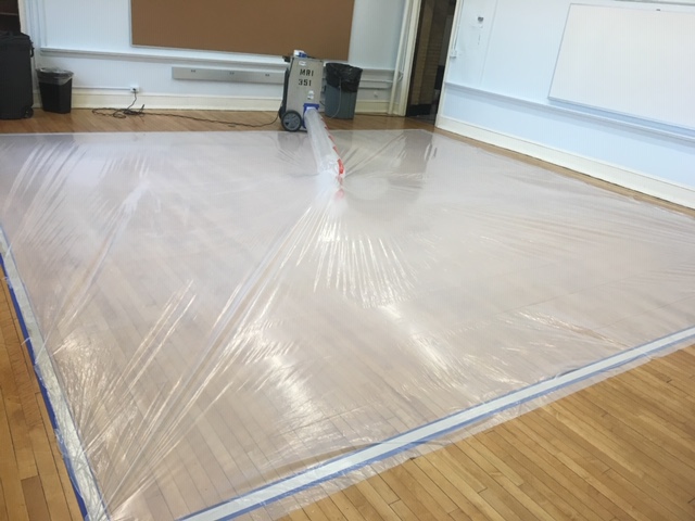 Modern grade air moving technology is being used to save this wood flooring.